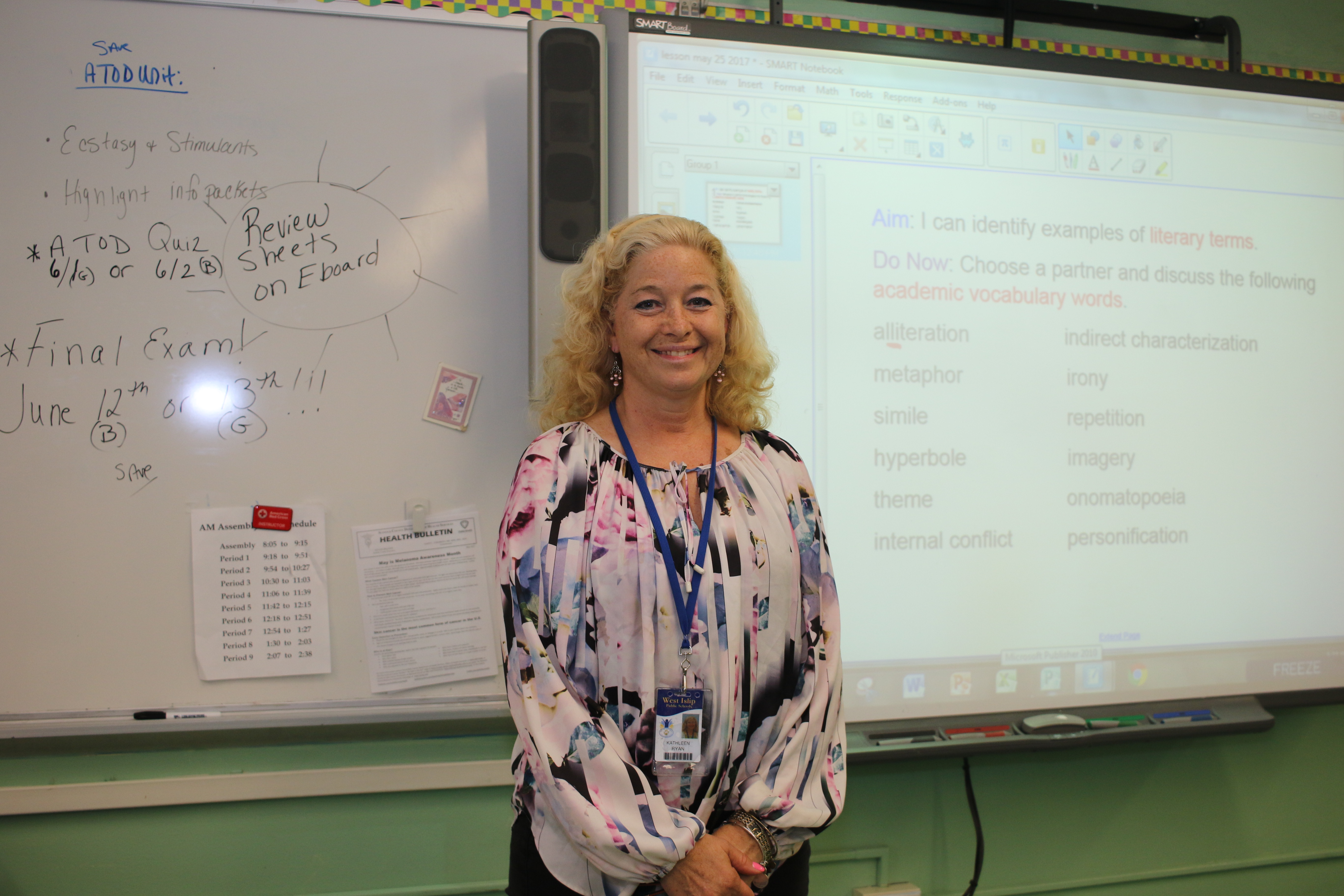 teacher in a white shirt with flowers on it 